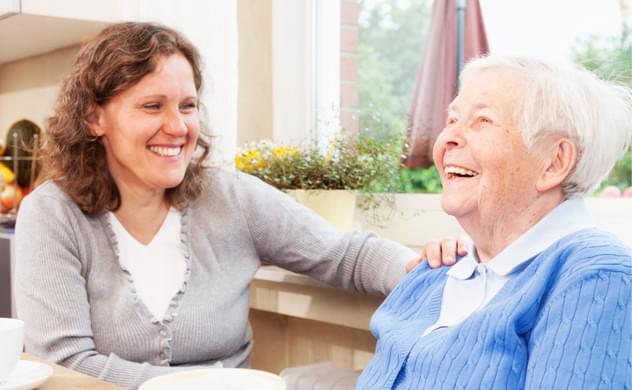 Visiting home carer with elederly woman